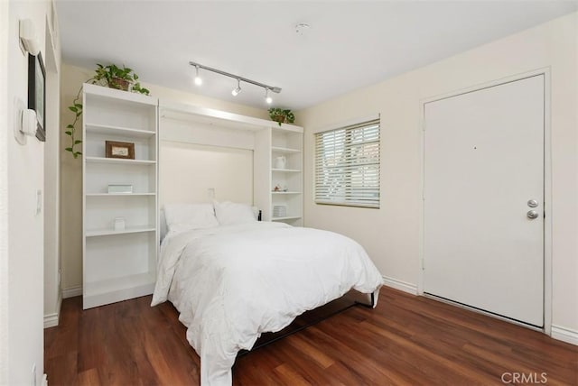 bedroom featuring dark hardwood / wood-style floors