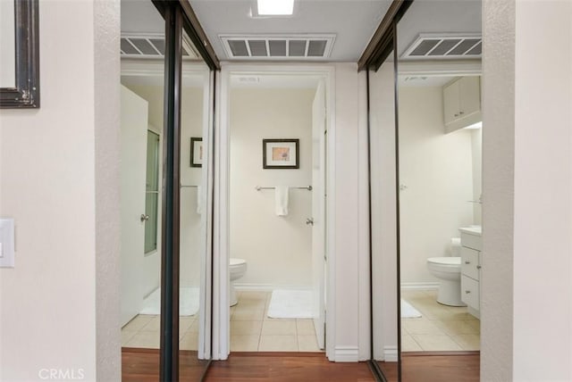 hall featuring tile patterned flooring