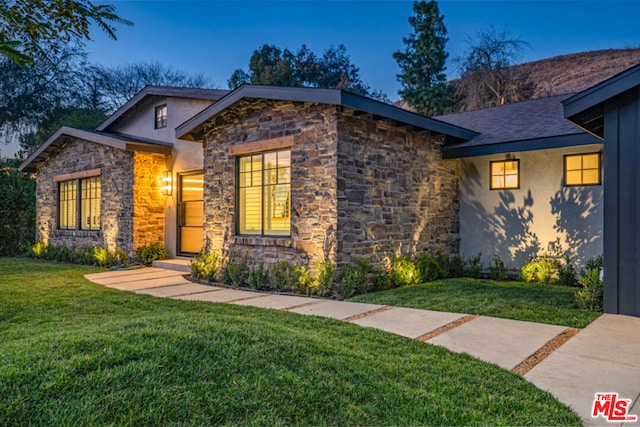 view of front of home with a front yard