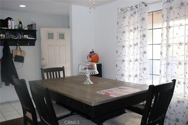 dining space with tile patterned flooring