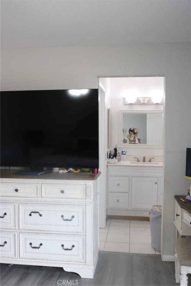 bathroom with tile patterned floors and vanity