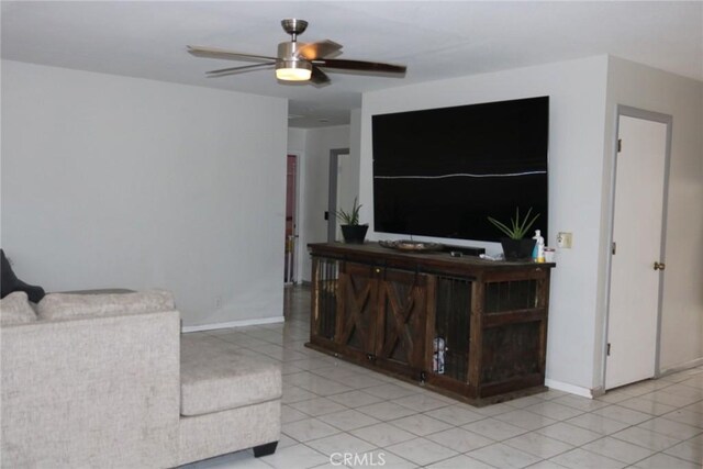 living room featuring ceiling fan and light tile patterned flooring