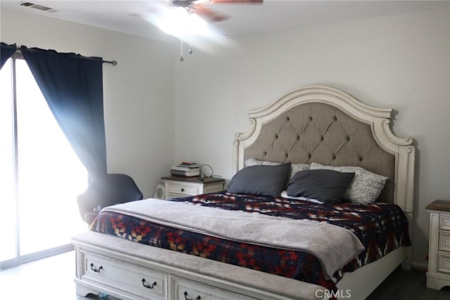 bedroom with multiple windows and ceiling fan