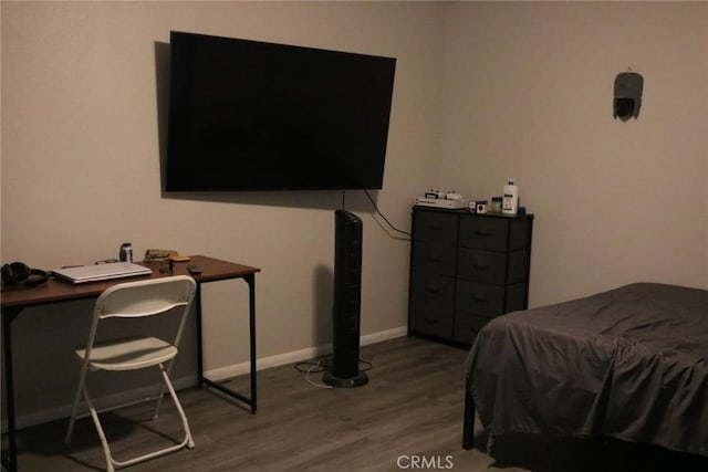 bedroom with wood-type flooring