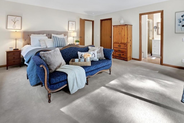 carpeted bedroom featuring connected bathroom