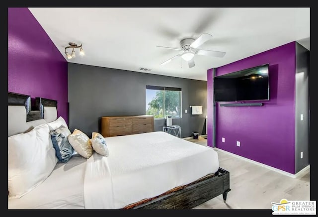 bedroom with ceiling fan and light hardwood / wood-style floors