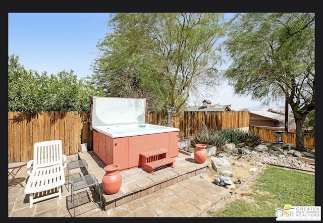 view of patio with a hot tub