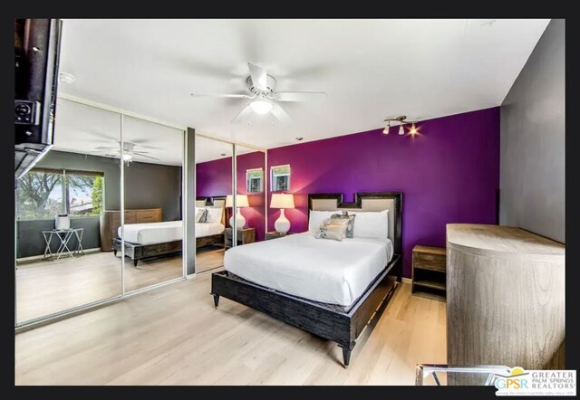 bedroom with ceiling fan and wood-type flooring