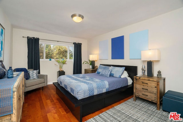 bedroom featuring dark hardwood / wood-style floors