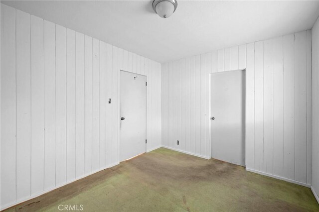 unfurnished room with carpet flooring