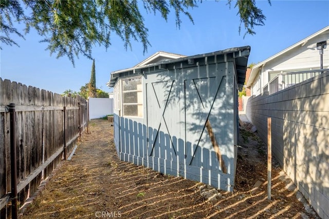 view of property exterior featuring a shed