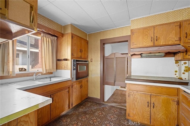 kitchen featuring black oven and sink