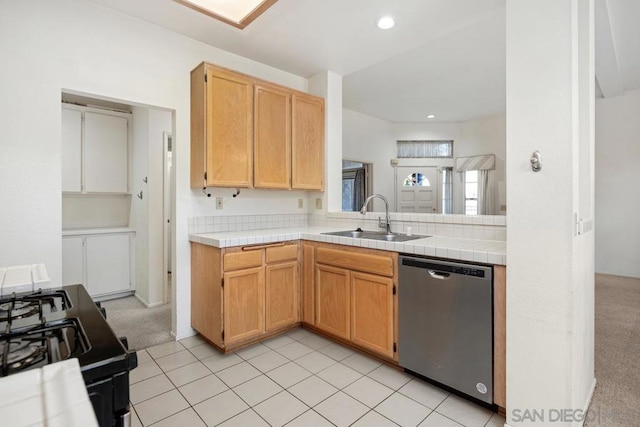 kitchen with tile countertops, black range, sink, stainless steel dishwasher, and light colored carpet