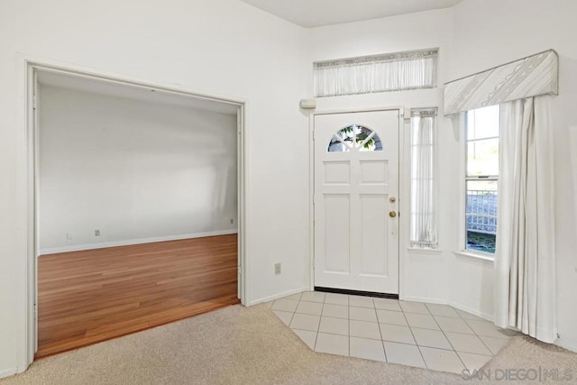 entrance foyer with light colored carpet