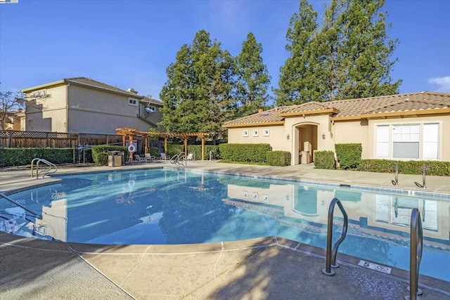 view of swimming pool featuring a pergola