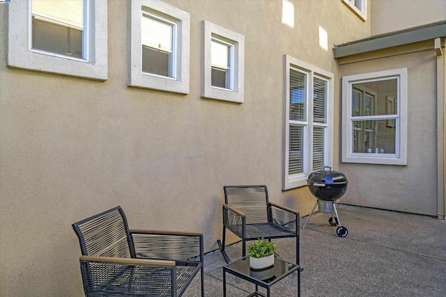 view of patio featuring a grill