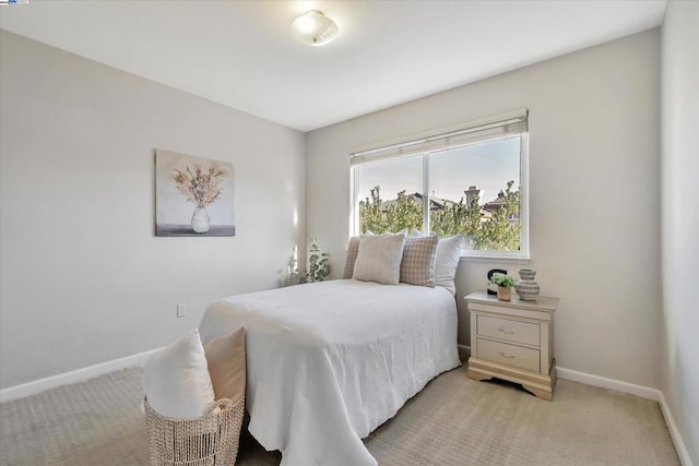 bedroom featuring light colored carpet