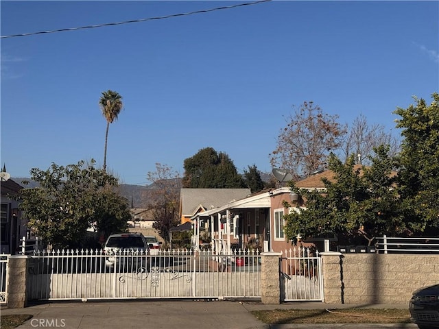 view of front facade featuring a gate and fence