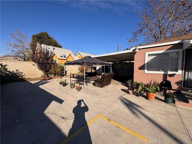 exterior space with an outdoor living space