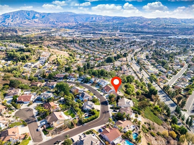 birds eye view of property featuring a mountain view