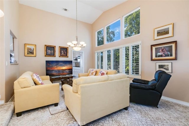 living room featuring vaulted ceiling and an inviting chandelier