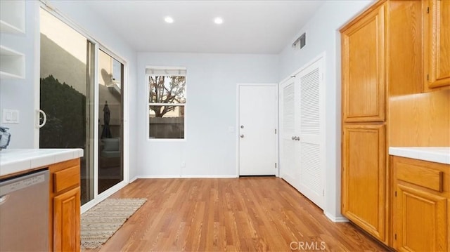 corridor with light hardwood / wood-style flooring