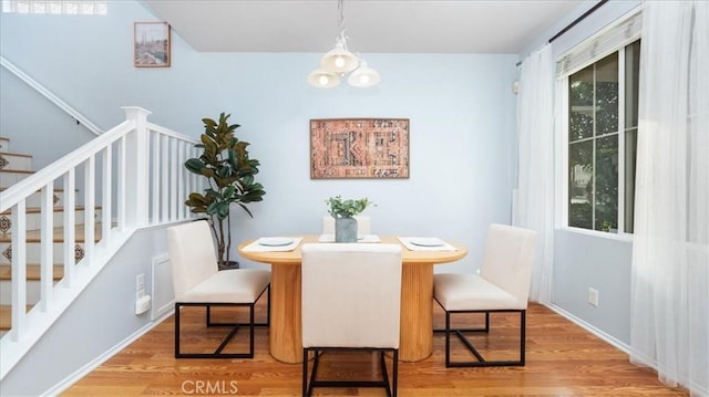 dining space with light hardwood / wood-style floors