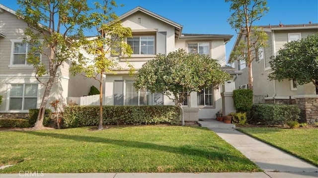 view of front of property with a front lawn