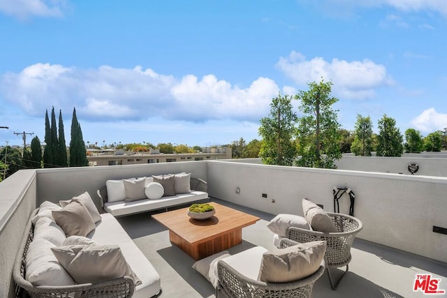 view of patio / terrace with a balcony and an outdoor living space