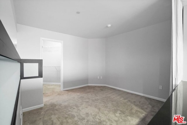 empty room with light colored carpet