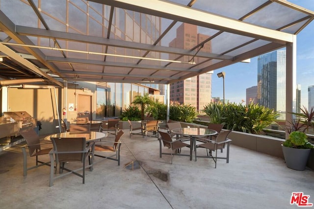 view of patio with a pergola and grilling area