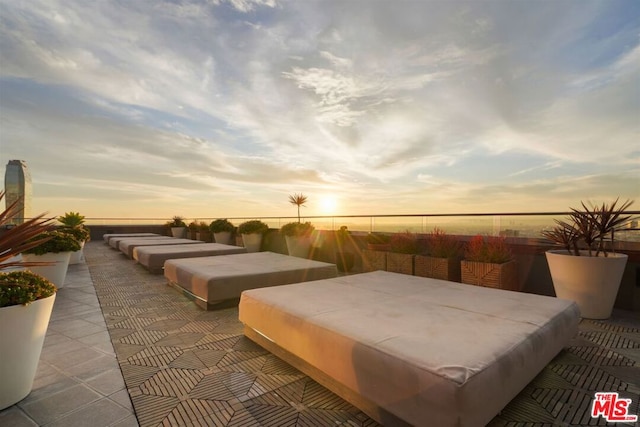 patio terrace at dusk with a hot tub