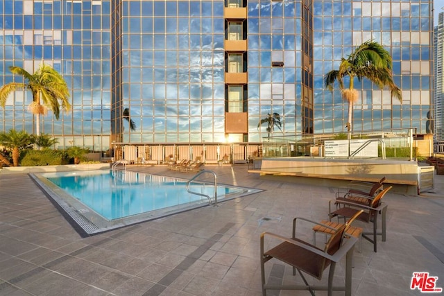 view of pool featuring a patio area