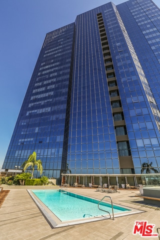 view of swimming pool with a patio area