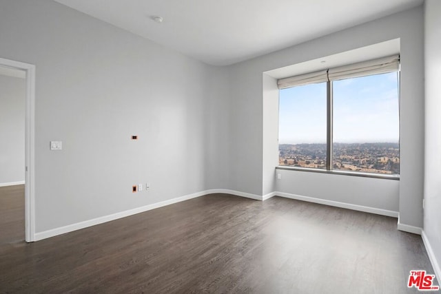 empty room featuring dark hardwood / wood-style floors