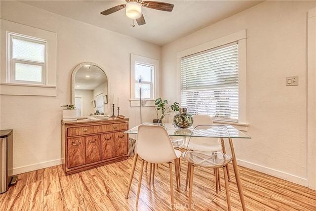 dining room featuring ceiling fan, light hardwood / wood-style floors, and plenty of natural light