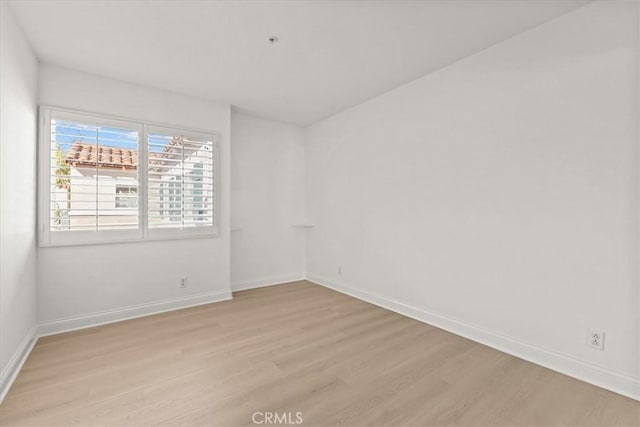 unfurnished room featuring light hardwood / wood-style floors