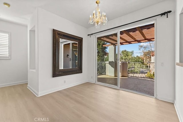 interior space with a chandelier and light wood-type flooring