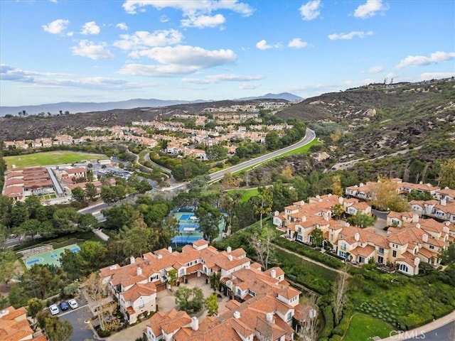 birds eye view of property with a mountain view