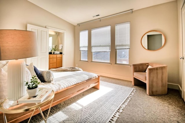 carpeted bedroom with lofted ceiling