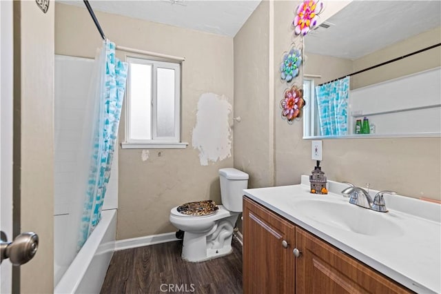 full bathroom featuring hardwood / wood-style flooring, toilet, vanity, and shower / tub combo with curtain