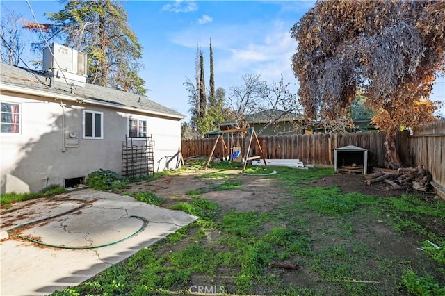 view of yard with a playground and a patio