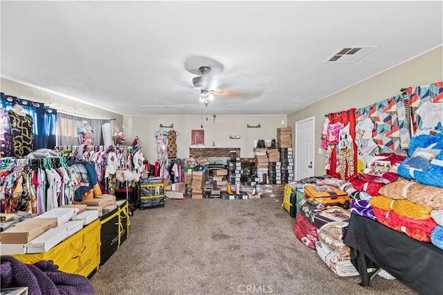 interior space with ceiling fan and carpet floors