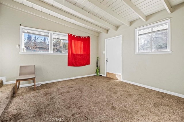 carpeted empty room with lofted ceiling with beams and wooden ceiling