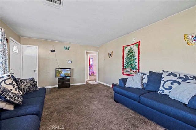 living room with dark colored carpet