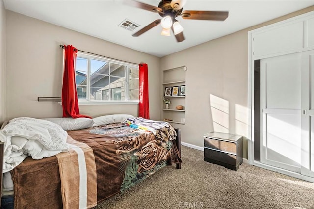 bedroom with ceiling fan and carpet floors