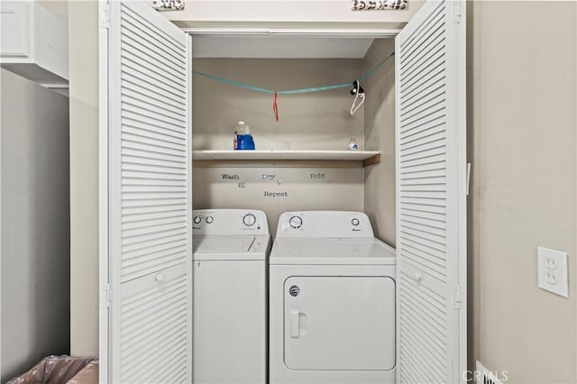 laundry area with separate washer and dryer