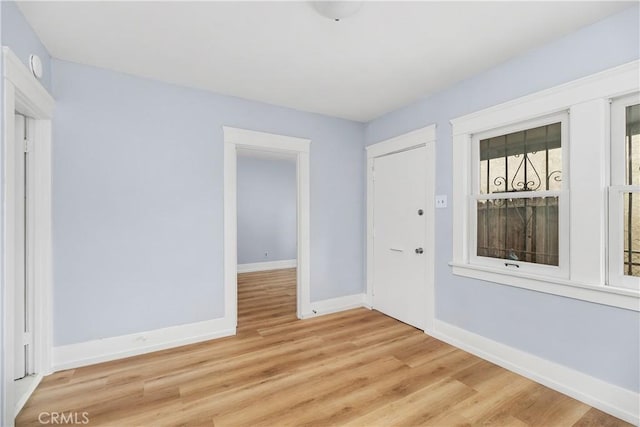 empty room with wood-type flooring