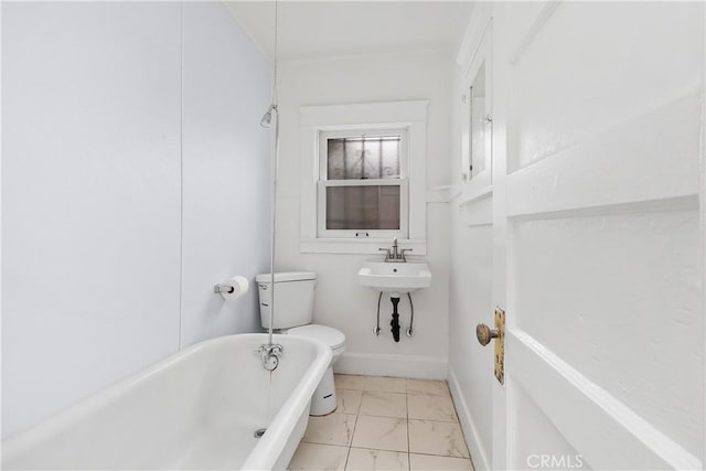 bathroom with toilet, tile patterned floors, a washtub, and sink