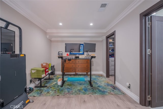 rec room with wood-type flooring and ornamental molding